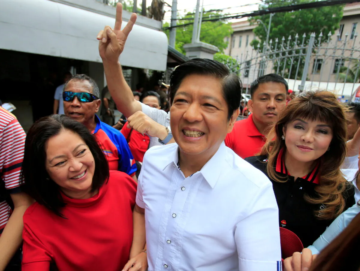 Ferdinand "Bongbong" Marcos Jr., son of late dictator Ferdinand Marcos Sr., arrives at the Supreme Court in Padre Faura, Metro Manila, Philippines, with his wife, Louise (L), and his sister, Imee, on April 2, 2018. (Romeo Ranoco/Reuters)