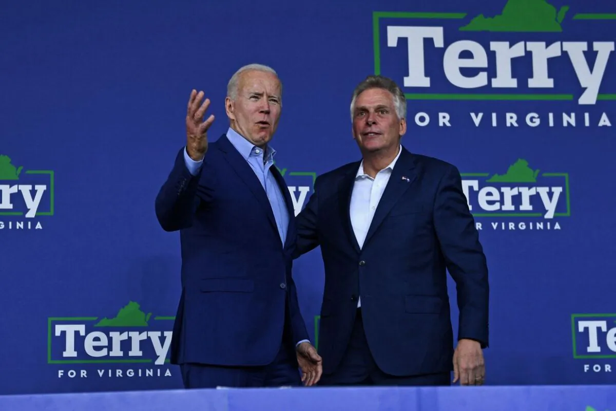 President Joe Biden (L) greets Virginia gubernatorial candidate Terry McAuliffe during a campaign event at Lubber Run Park, Arlington, Virginia on July 23, 2021. (Brendan Smialowski/AFP via Getty Images)