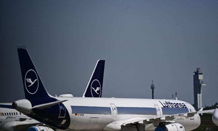 Parked aircrafts operated by German airline Lufthansa are pictured at Berlin Brandenburg BER airport Willy-Brandt in Schoenefeld near Berlin, Germany, on May 31, 2021. (Tobias Schwarz/AFP via Getty Images)
