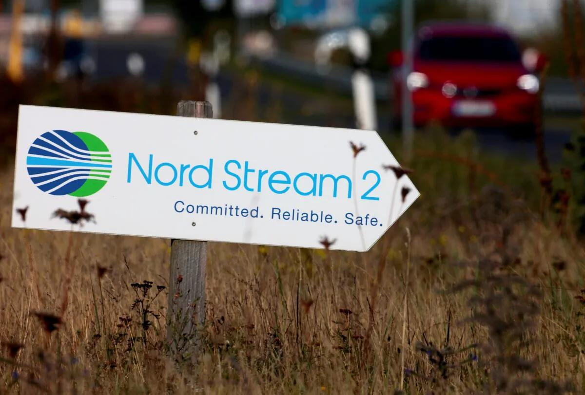 A road sign directs traffic towards the Nord Stream 2 gas line landfall facility entrance in Lubmin, Germany, on Sept. 10, 2020. (Hannibal Hanschke/Reuters)