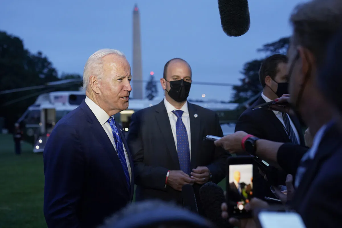 President Joe Biden talks with reporters after returning to the White House in Washington on Oct. 5, 2021. (Susan Walsh/AP Photo)