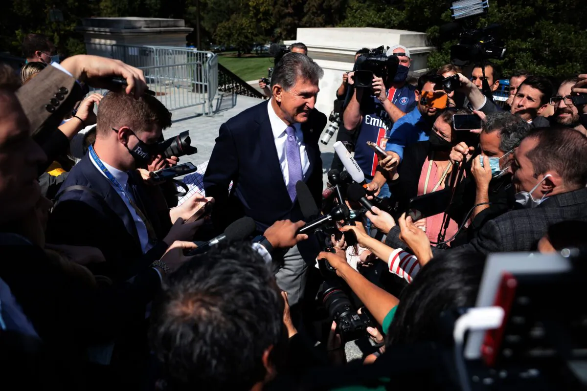 Sen. Joe Manchin (D-W.Va.) speaks to reporters outside the U.S. Capitol in Washington on Sept. 30, 2021. (Win McNamee/Getty Images)
