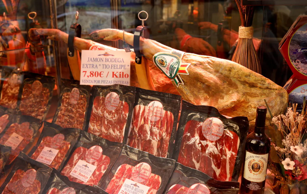 Hams and slices of ham are seen in a bar in Madrid on Oct. 3, 2019. (Jon Nazca/Reuters)