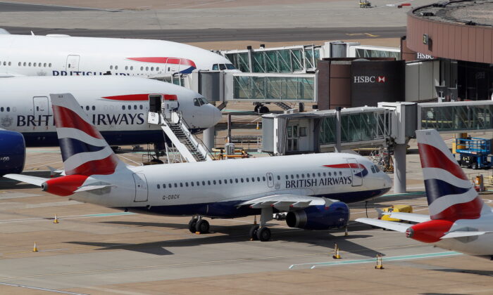 British Airways aircraft are parked at the South Terminal at Gatwick Airport, in Crawley, Britain, on Aug. 25, 2021.  (Peter Nicholls/Reuters)