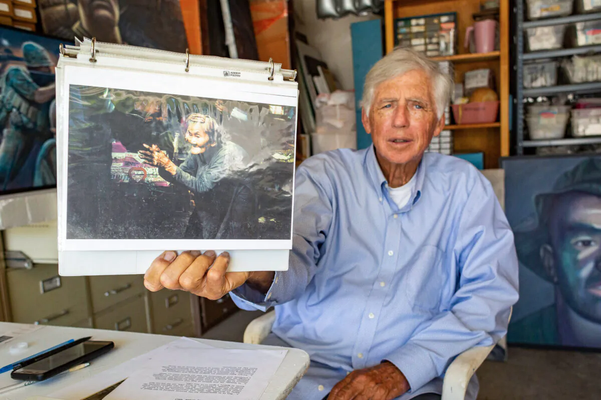 Former combat artist Ed Bowen displays one of his paintings in Newport Beach, Calif., on Sept. 14, 2021. (John Fredricks/The Epoch Times)