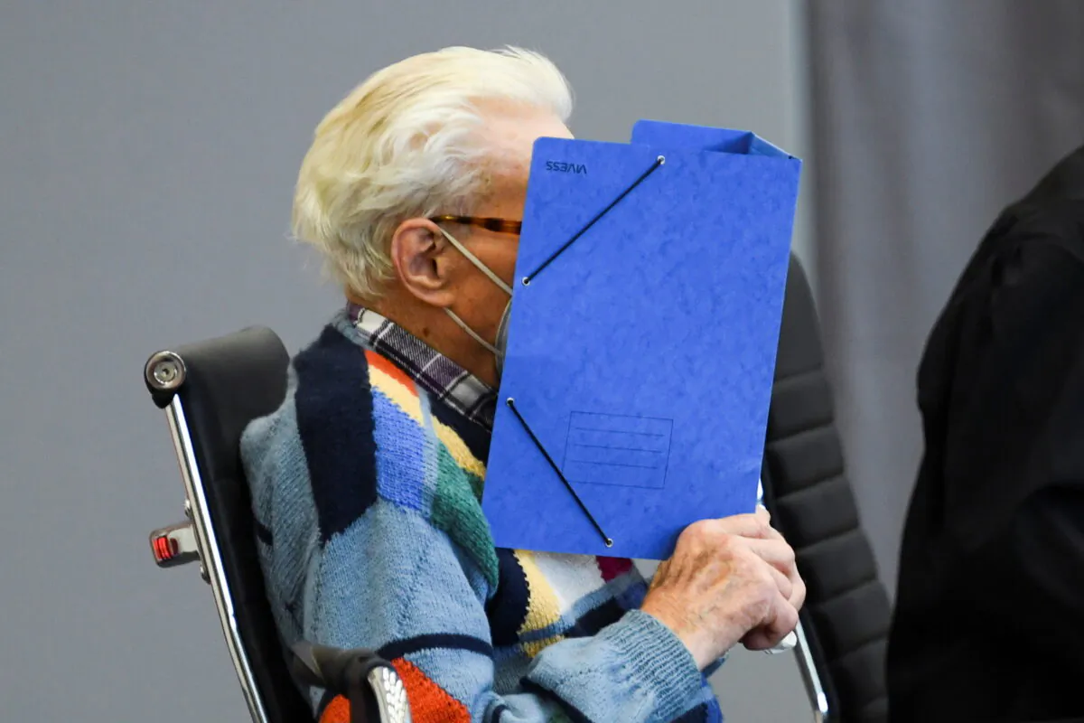 A 100-year-old former security guard of the Sachsenhausen concentration camp appears in the courtroom before his trial at the Landgericht Neuruppin court in Brandenburg, Germany, on Oct. 7, 2021. (Annegret Hilse/Reuters)