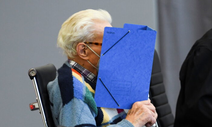 A 100-year-old former security guard of the Sachsenhausen concentration camp appears in the courtroom before his trial at the Landgericht Neuruppin court in Brandenburg, Germany, on Oct. 7, 2021. (Annegret Hilse/Reuters)
