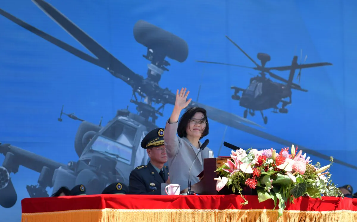 Taiwan's President Tsai Ing-wen waves during a ceremony to commission new U.S.-made Apache AH-64E attack helicopters at a military base in Taoyuan, Taiwan, on July 17, 2018. (Sam Yeh/AFP)