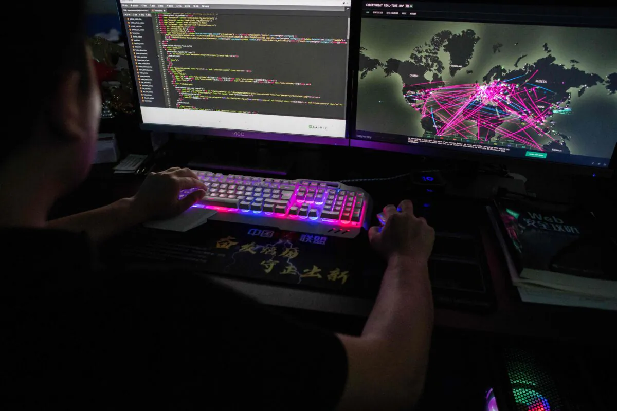 Prince, a member of the hacking group Red Hacker Alliance who refused to give his real name, uses a website that monitors global cyberattacks on his computer at their office in Dongguan, China's southern Guangdong province, on Aug. 4, 2020. (Nicolas Asfouri/AFP via Getty Images)