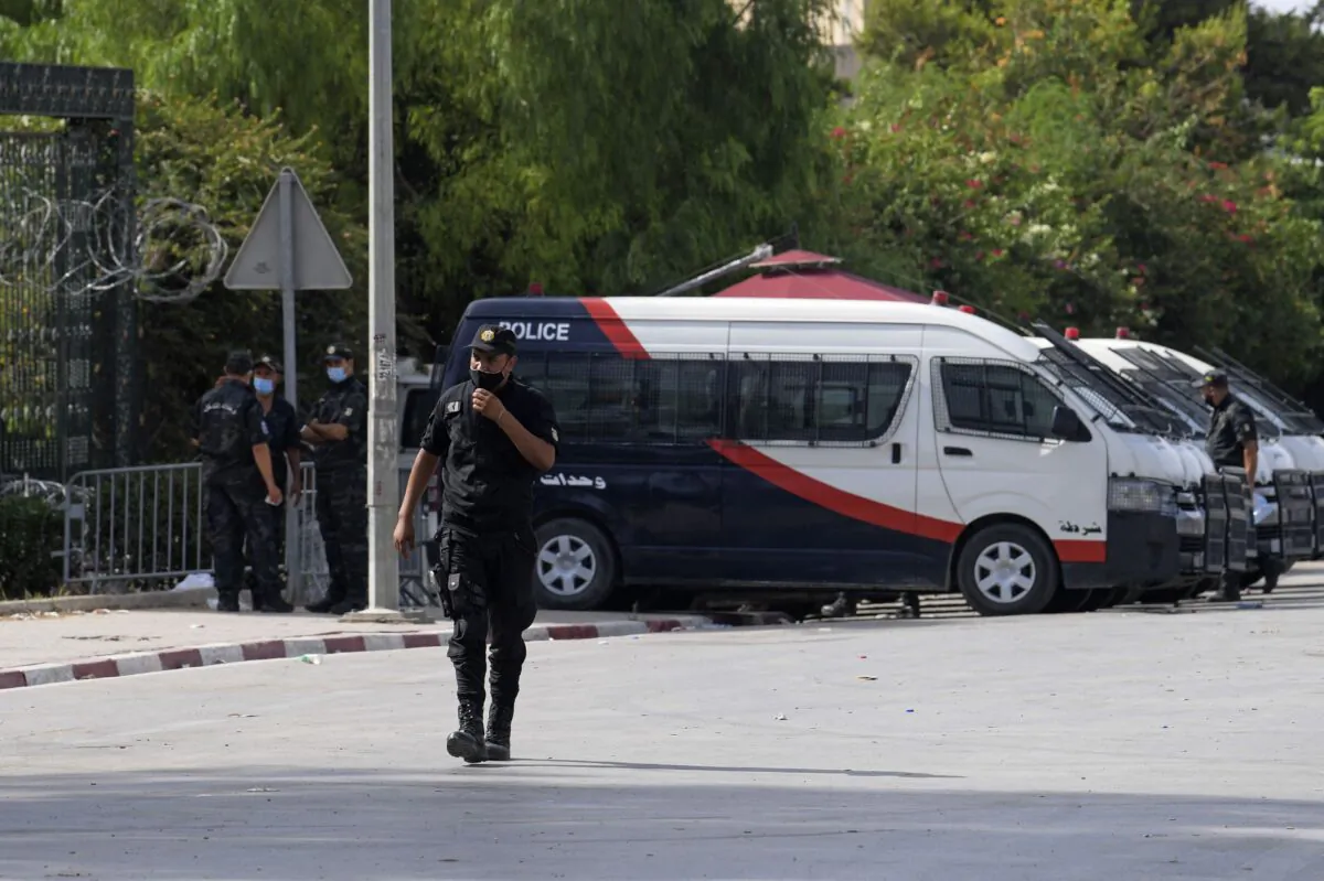 Tunisian police stand guard outside the parliament in Tunis on July 27, 2021. (Fethi Belaid/AFP via Getty Images)