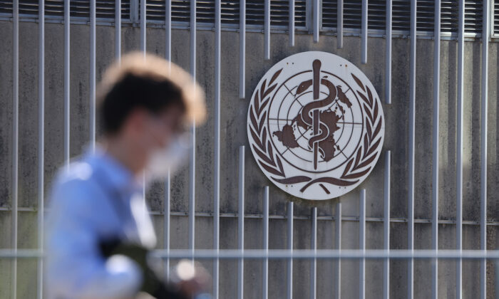 A man enters the headquarters of the World Health Organization in Geneva, Switzerland, on June 15, 2021. (Sean Gallup/Getty Images)