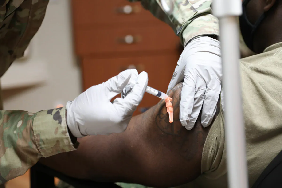 A U.S. Navy service member is seen getting a COVID-19 vaccine in Pyeongtaek, South Korea, on Dec. 29, 2020. (United States Forces Korea via Getty Images)