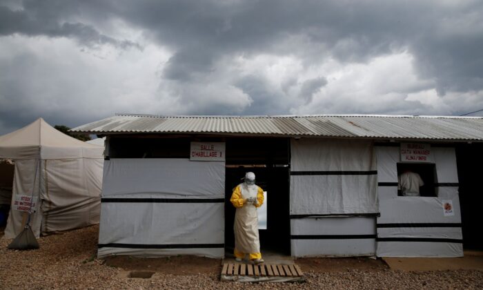 A health worker wearing Ebola protection gear,  before entering the Biosecure Emergency Care Unit (CUBE) at the ALIMA (The Alliance for International Medical Action) Ebola treatment center in Beni, Congo, on March 30, 2019. (Baz Ratner/Reuters)