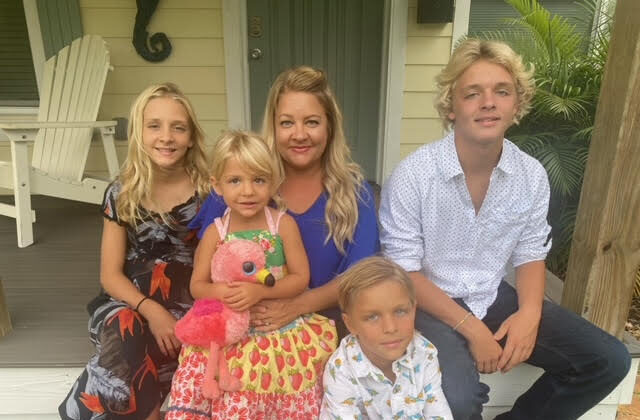 Rylin, Hartlyn, Casey Paxton and Nolan Goff gather on the front porch  of their home in Flagler Beach, Fla. October 7, 2021 (Photo, courtesy of Casey Goff) 