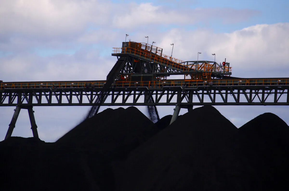 Coal is unloaded onto large piles at the Ulan Coal mines near the central New South Wales rural town of Mudgee in Australia, on March 8, 2018. (David Gray/Reuters)