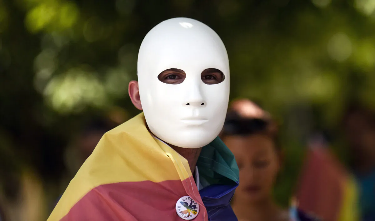 A participant with a face mask in a lesbian, gay, bisexual, and transgender (LGBT) pride parade in Pristina, Kosovo, on July 1, 2021. (Armend Nimani/AFP via Getty Images)