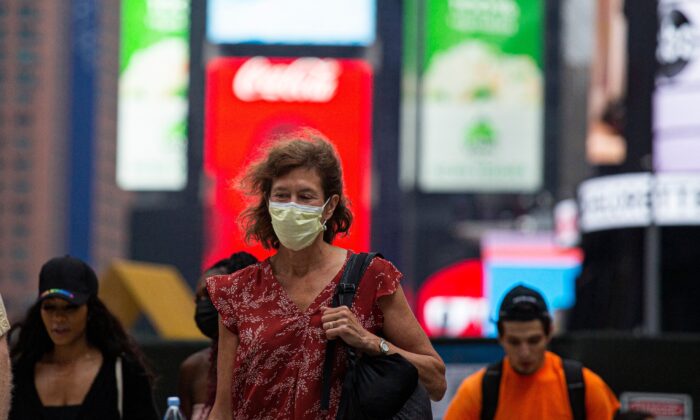 A woman wears a face mask in Midtown Manhattan in New York on July 29 2021. (Kena Betancur/AFP via Getty Images)