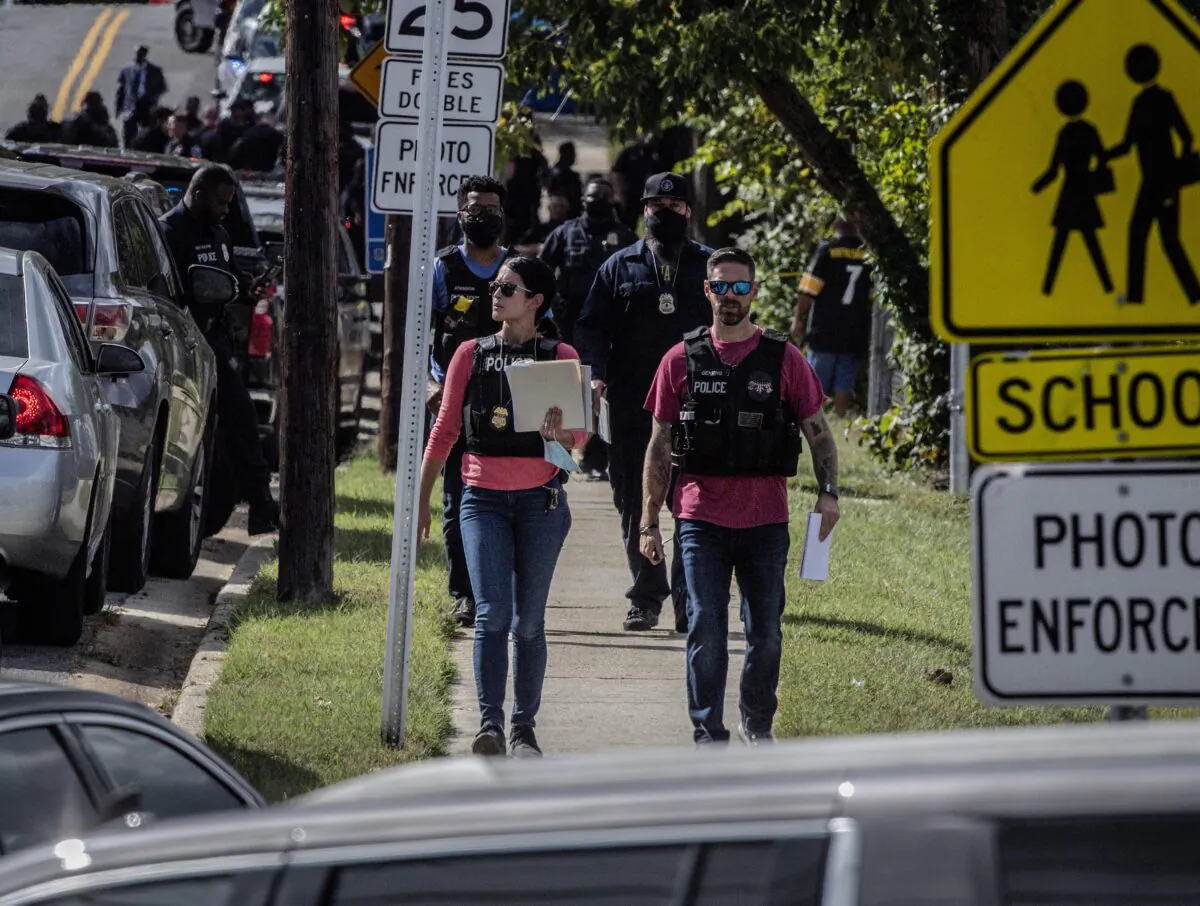 Police arrive at the scene of a shooting at a senior housing apartment in Capitol Heights, Md., on Oct. 8, 2021. (Bill O'Leary/The Washington Post via AP)