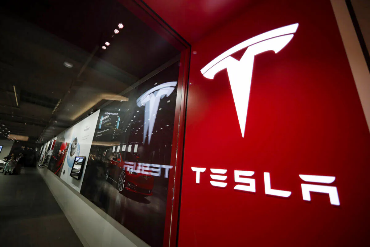 A sign bearing the company logo outside a Tesla store in Cherry Creek Mall in Denver, on Feb. 9, 2019. (David Zalubowski/AP Photo)