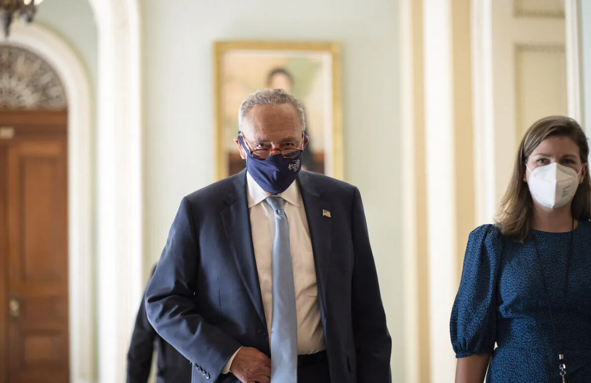 Senate Majority Leader Chuck Schumer (D-N.Y.) walks to a lunch meeting with Senate Democrats at the U.S. Capitol in Washington, on Oct. 7, 2021. (Drew Angerer/Getty Images)