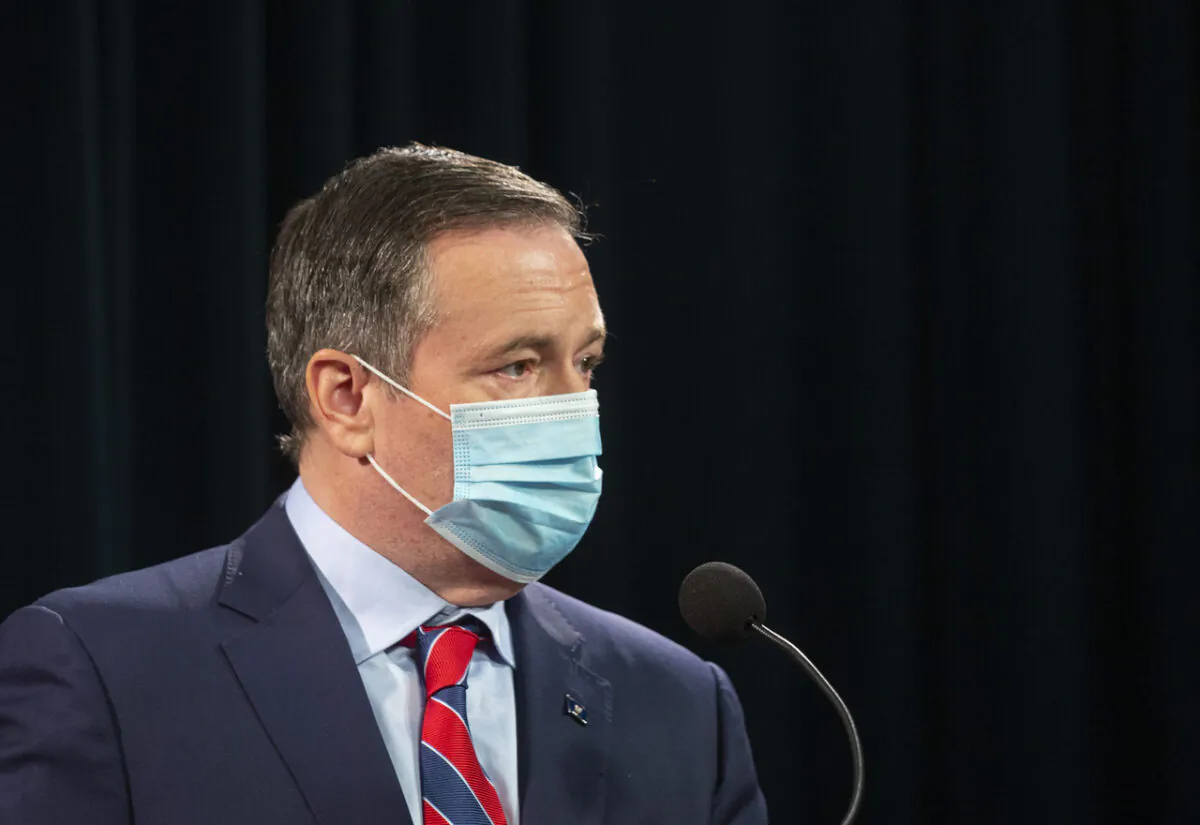 Alberta Premier Jason Kenney takes the podium at a news conference where the provincial government announced new restrictions because of the surging COVID cases in the province, in Calgary, Alta., on Sept. 3, 2021. (The Canadian Press/Todd Korol)