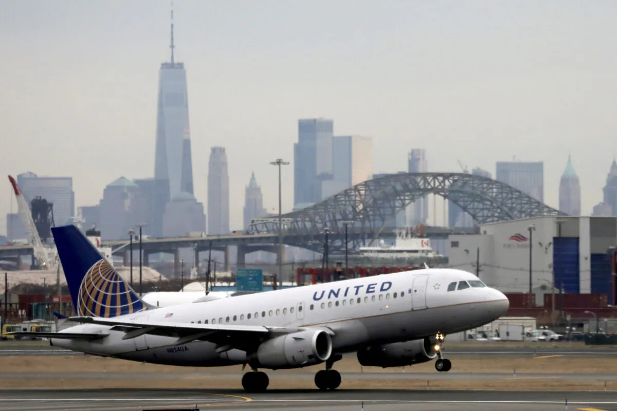 A United Airlines passenger jet takes off with New York City as a backdrop at Newark Liberty International Airport in Newark, N.J., on Dec. 6, 2019. (Chris Helgren/Reuters)