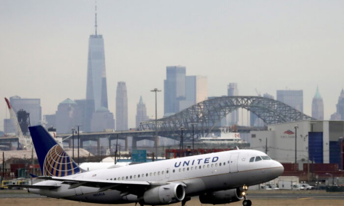 A United Airlines passenger jet takes off with New York City as a backdrop at Newark Liberty International Airport in Newark, N.J., on Dec. 6, 2019. (Chris Helgren/Reuters)