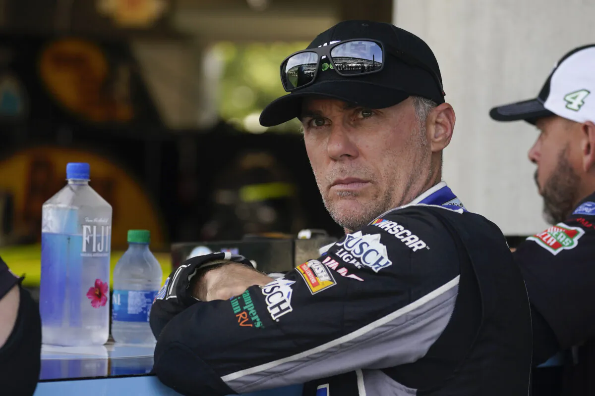 Kevin Harvick waits in his garage before practice for the NASCAR Cup Series at Indianapolis Motor Speedway in Indianapolis, Aug. 14, 2021. (Darron Cummings/AP Photo/)