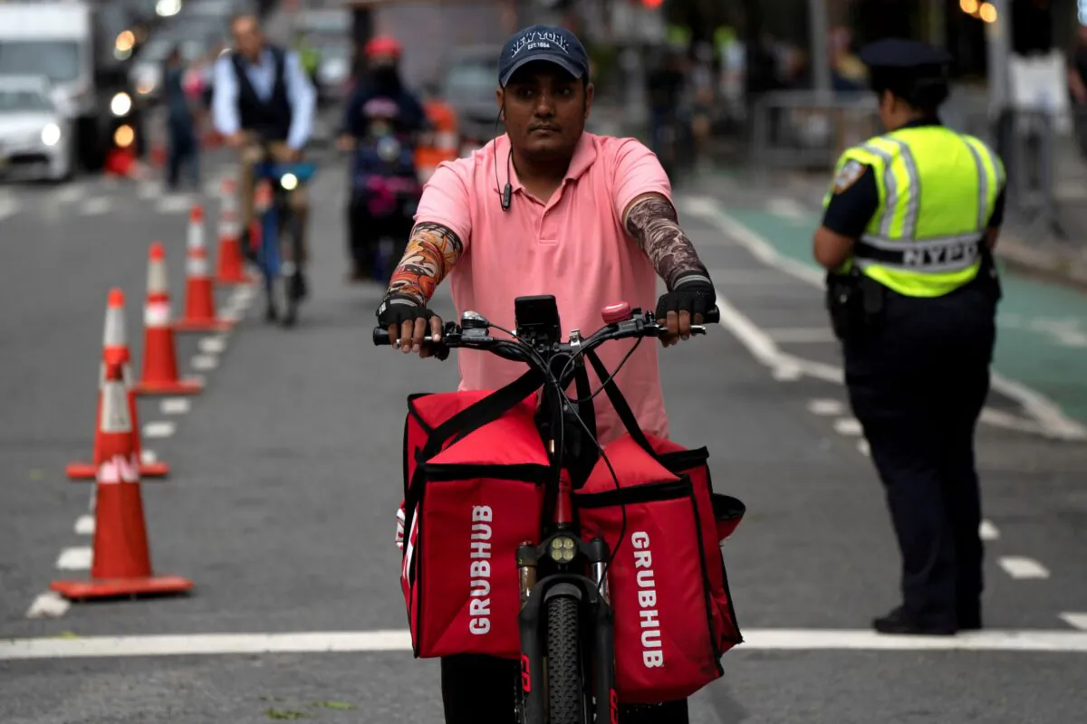 A delivery worker is pictured on the street in New York on Sept. 23, 2021. (David 'Dee' Delgado/Reuters)