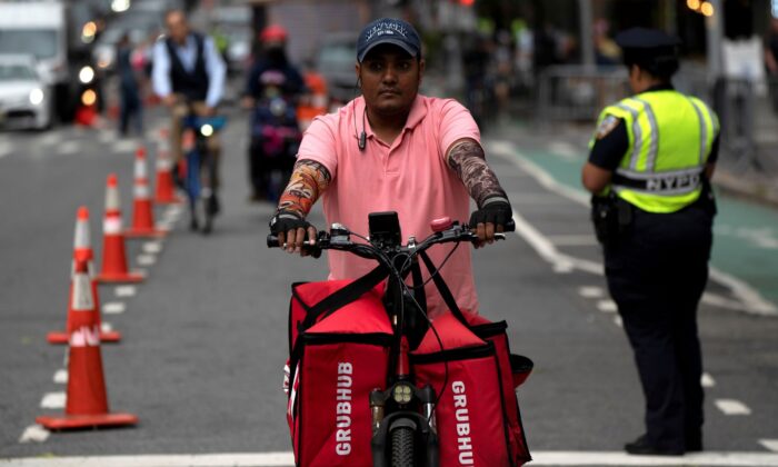 A delivery worker is pictured on the street in New York on Sept. 23, 2021. (David 'Dee' Delgado/Reuters)