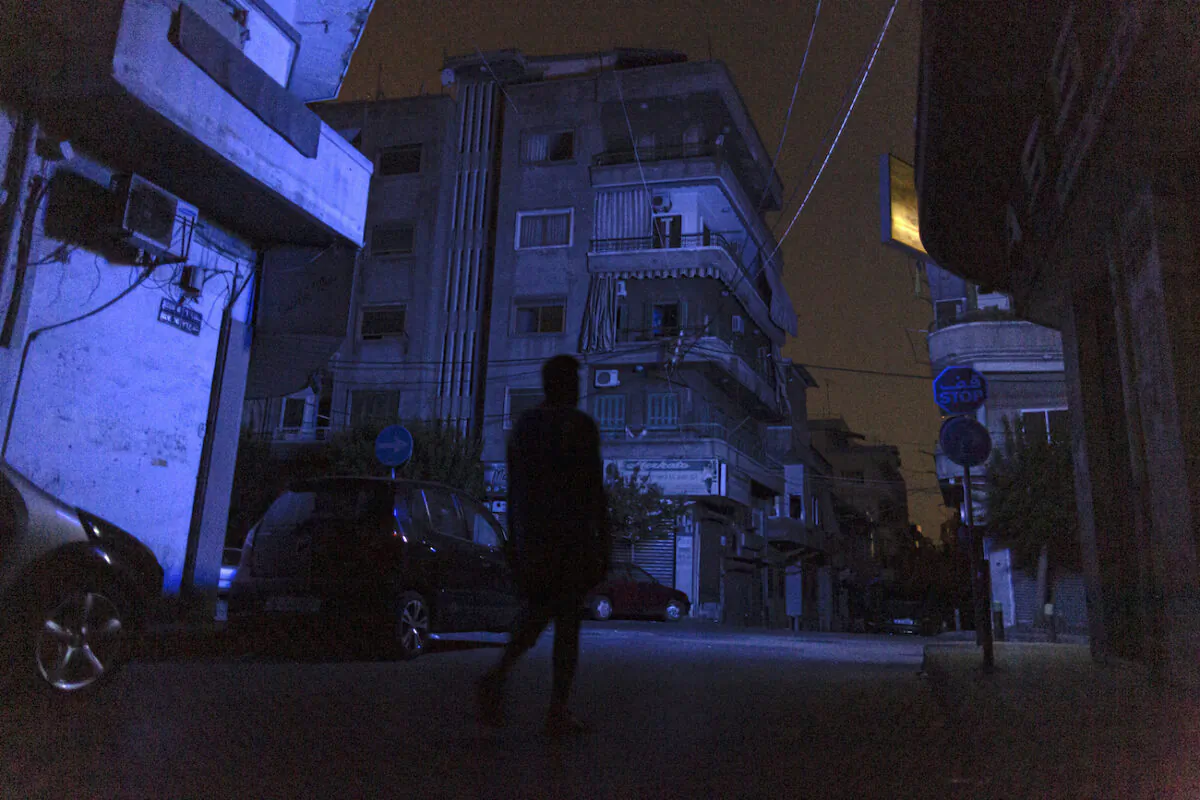 A man walks through Beirut during a blackout in Beirut, Lebanon, on Aug. 14, 2021. (Sam Tarling/Getty Images)