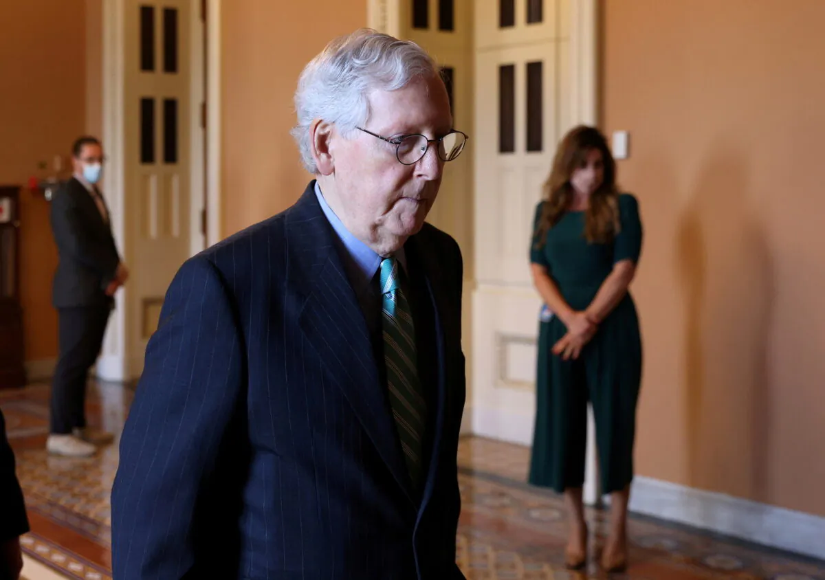 Senate Republican Leader Mitch McConnell (R-Ky.) walks to his office at the U.S. Capitol in Washington on Oct. 7, 2021. (Leah Millis/Reuters)