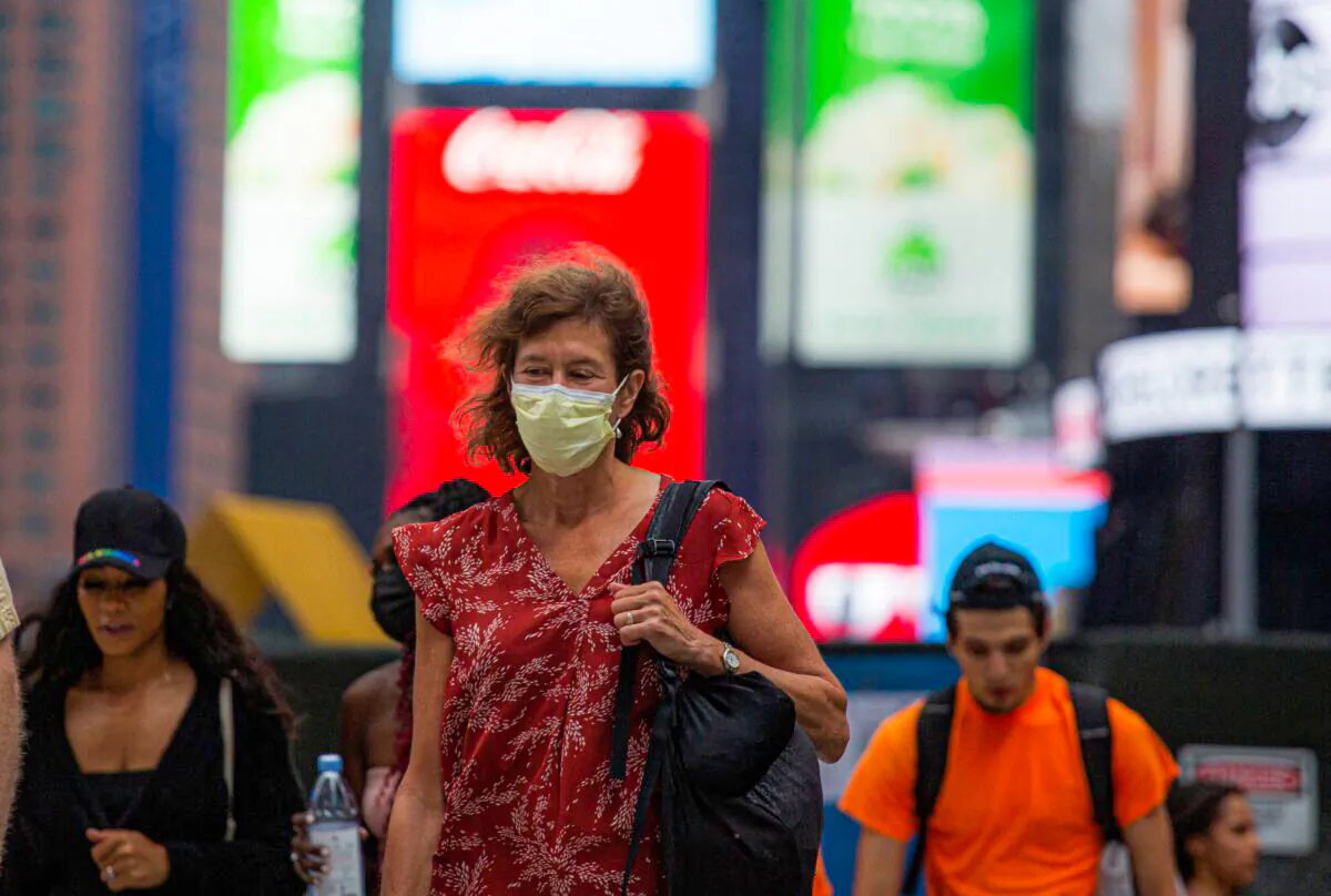 A woman wears a face mask in Midtown Manhattan in New York on July 29 2021. (Kena Betancur/AFP via Getty Images)