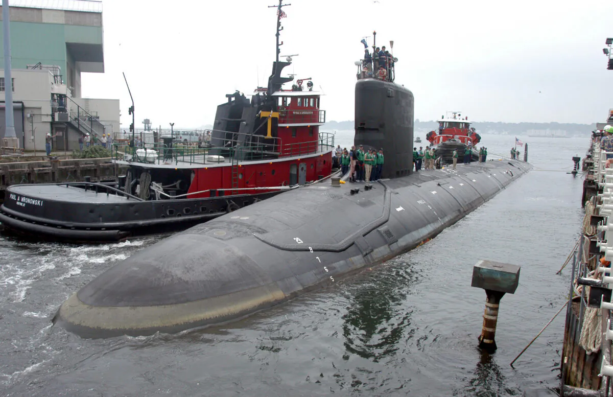 The U.S.S. Virginia returns to the Electric Boat Shipyard in Groton Conn., after its first sea trials on July 30, 2004. (Jack Sauer/AP Photo)