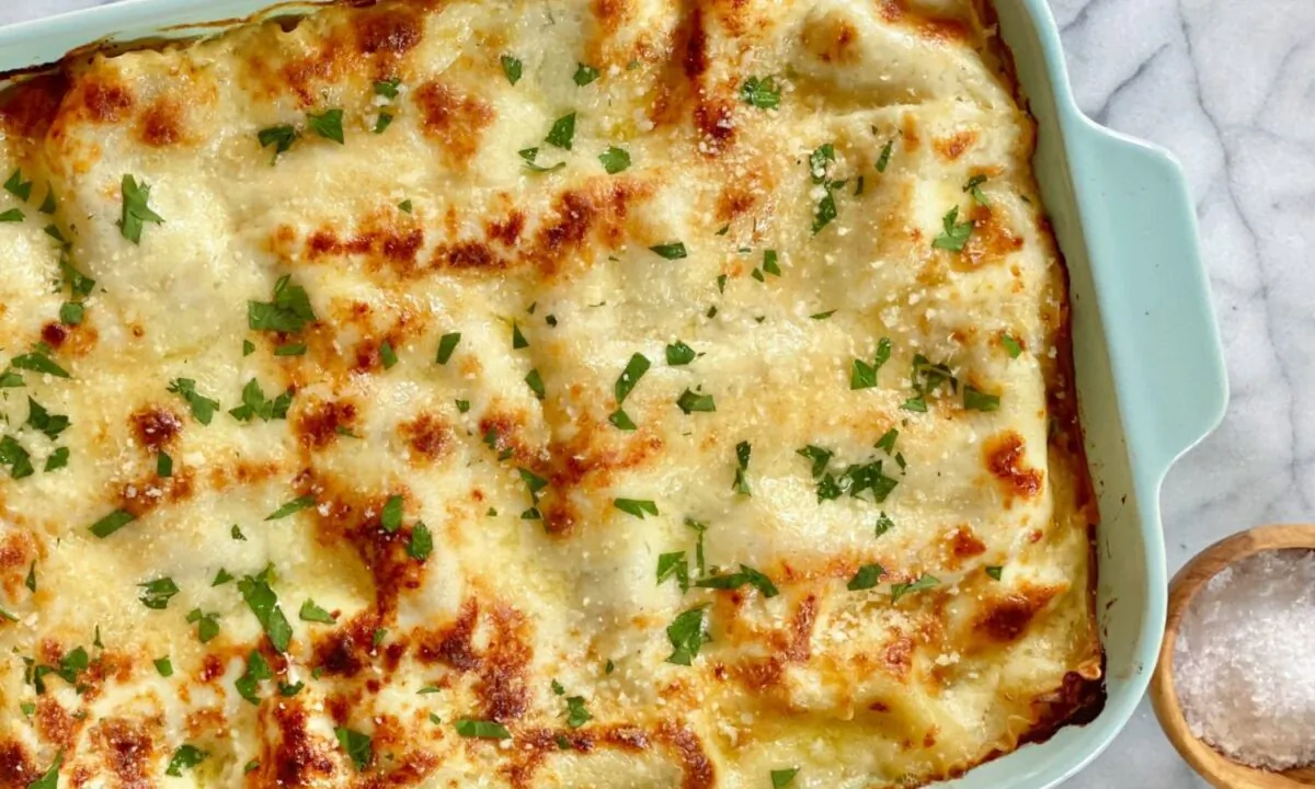 This lasagna is built with layers of hearty pasta, ricotta, mozzarella, Italian sausage crumbles, and an entire pound of fresh spinach. (Kelli Foster/TNS)