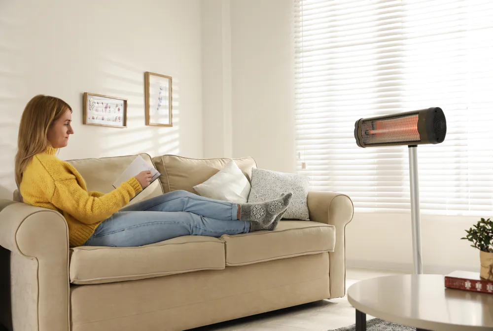 Use a space heater to heat only the rooms that are occupied, and keep your furnace set very low. (New Africa/Shutterstock)