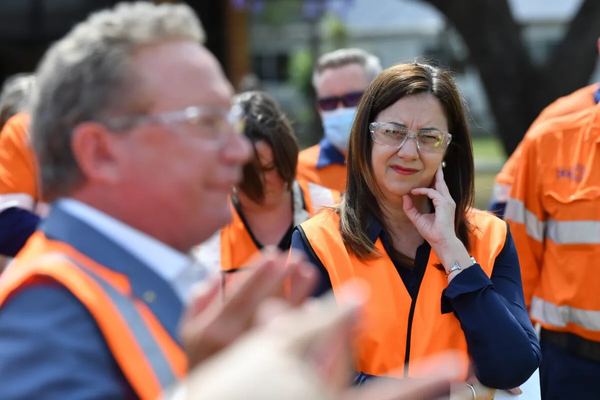 Queensland Premier Annastacia Palaszczuk (right) and Andrew Forrest (left) from Fortescue Future Industries talks to the media during a hydrogen announcement at Incitec Pivot on Gibson Island in Brisbane, Australia on Oct. 11, 2021. (AAP Image/Darren England) 