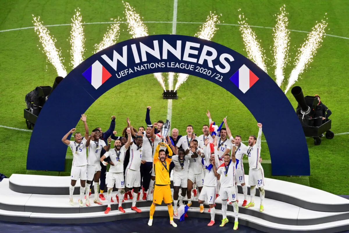French players react with their trophy after defeating Spain to win the UEFA Nations League final soccer match at the San Siro stadium, in Milan, Italy, on Oct. 10, 2021. (Miguel Medina/Pool Photo via AP)