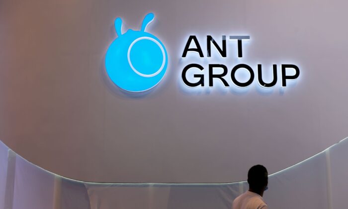 A man walks past an Ant Group logo at the World Artificial Intelligence Conference (WAIC) in Shanghai, China, on July 8, 2021. (Yilei Sun/Reuters)