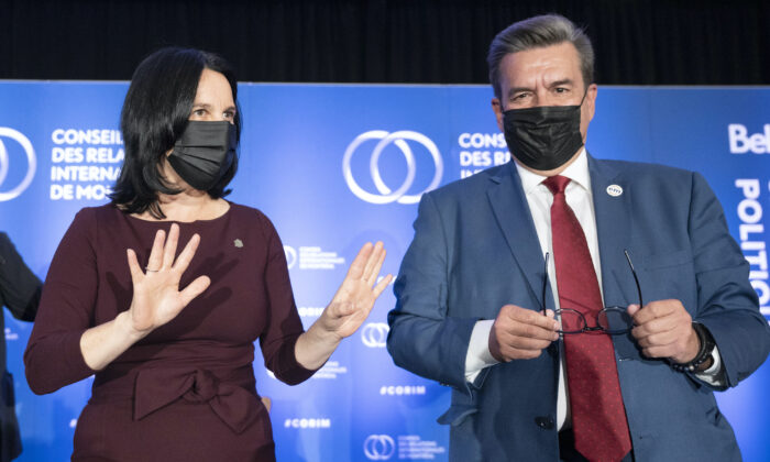 Montreal mayoral candidates Valerie Plante (L) and Denis Coderre pose for photos after their debate in Montreal on Sept. 29, 2021. ( Canadian Press/Ryan Remiorz)