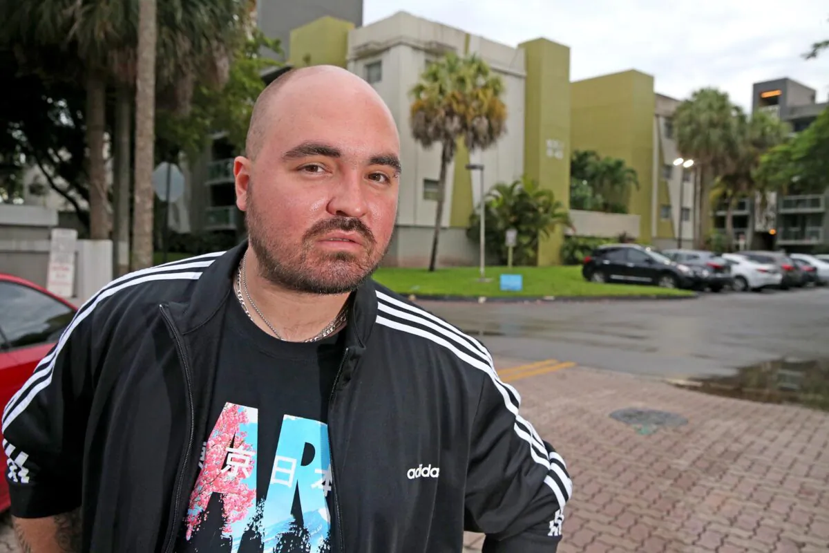 Carlos Lomena outside the Axis at One Pine apartments, where he was evicted in Plantation, Fla., on June 28, 2021. (Charles Trainor Jr./Miami Herald/TNS)