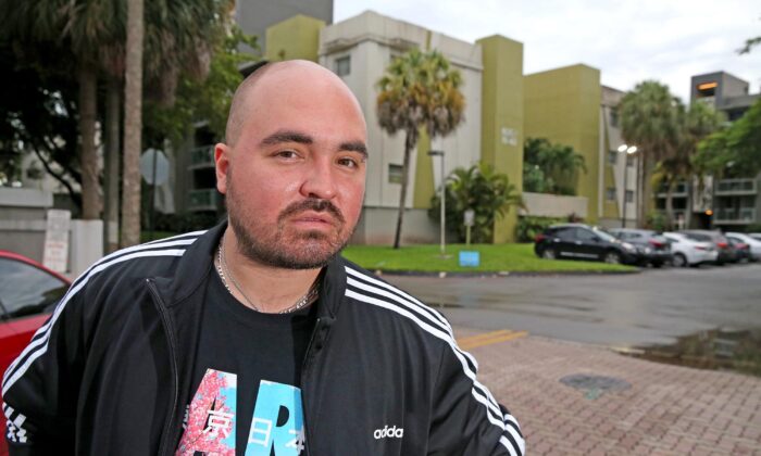 Carlos Lomena outside the Axis at One Pine apartments, where he was evicted in Plantation, Fla., on June 28, 2021. (Charles Trainor Jr./Miami Herald/TNS)