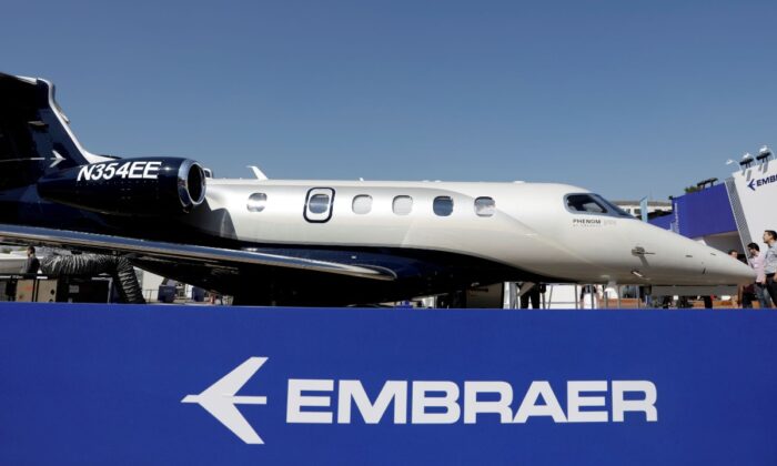 An Embraer Phenom 300E aircraft is displayed during the Latin American Business Aviation Conference & Exhibition fair at Congonhas Airport in Sao Paulo, Brazil, on Aug.14, 2018. (Paulo Whitaker/Reuters)