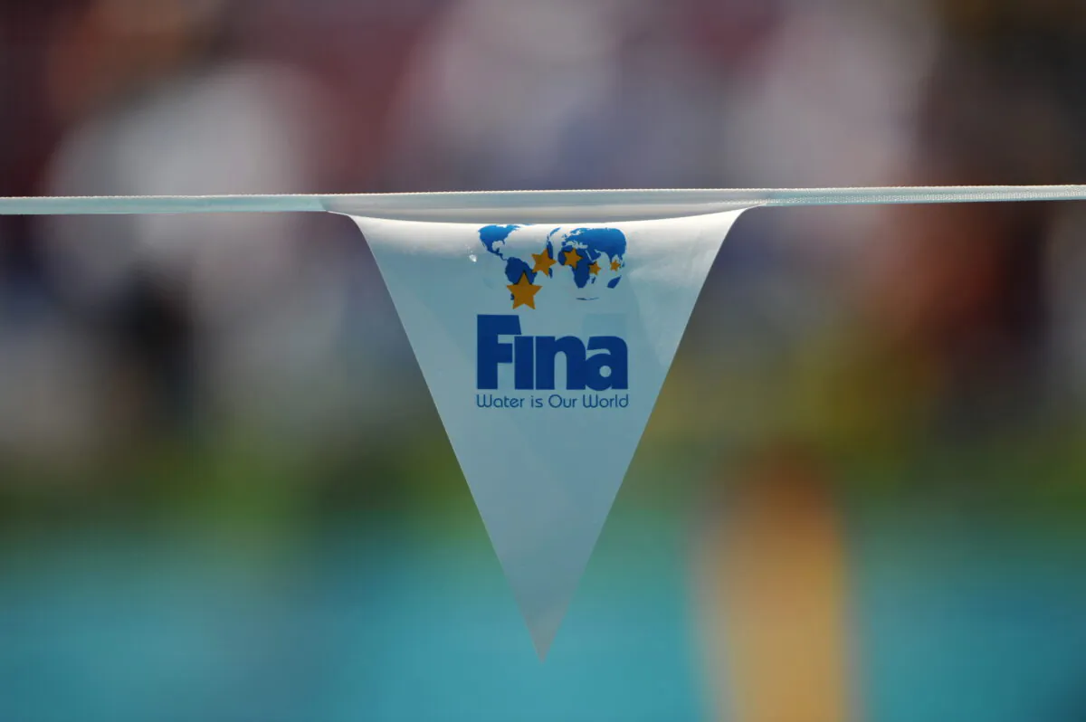 The logo of the Swimming governing body FINA is displayed on a flag at the main swimming pool at the 13th FINA World Swimming Championships in Rome on July 26, 2009.  (Photo credit should read MARTIN BUREAU/AFP via Getty Images)
