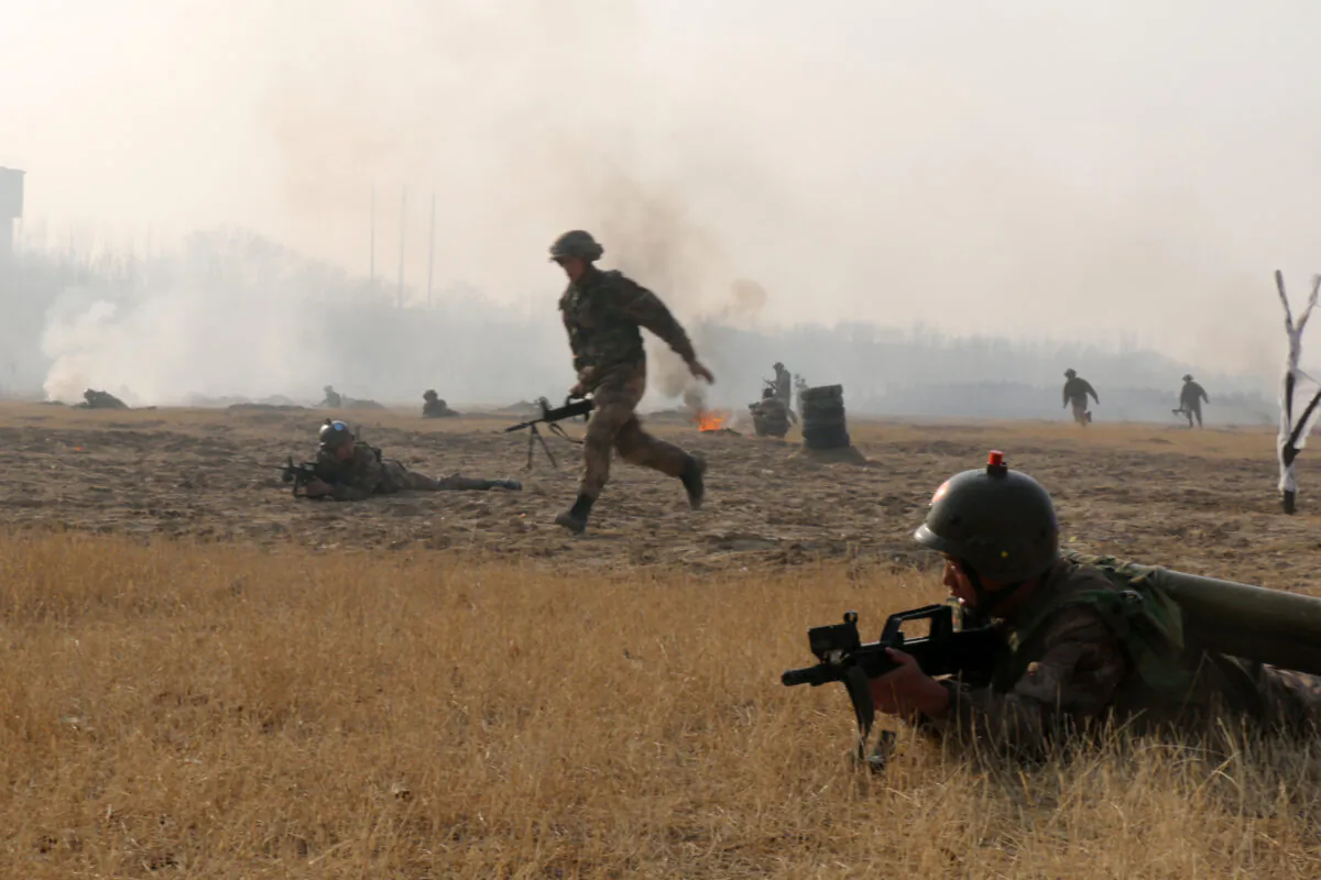 Army officers and soldiers in action during a drill on Jan. 3, 2017 in Yinchuan, Ningxia Hui region of China.  (Getty Images)