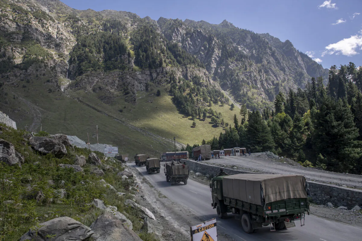 An Indian army convoy moves on the Srinagar-Ladakh highway at Gagangeer, northeast of Srinagar, Indian-controlled Kashmir on Sept. 9, 2020. (Dar Yasin/AP Photo)