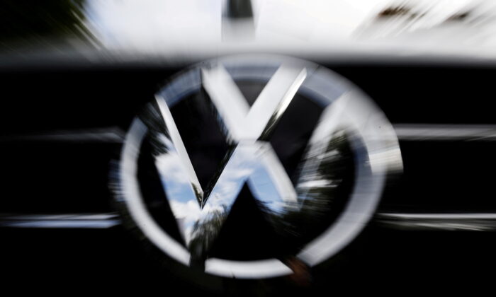  VW logo is seen at the site of the first hearing against VW over the diesel emissions cheating scandal, at the Higher Regional Court in Braunschweig, Germany on Sept. 30, 2019. (Michele Tantussi/Reuters)
