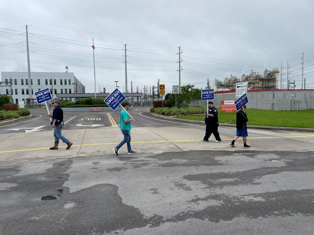 United Steelworkers union members picket outside the Exxon Mobil Beaumont, after being locked out of the plant by the company, in Beaumont, Texas on May 1, 2021. (Erwin Seba/Reuters)