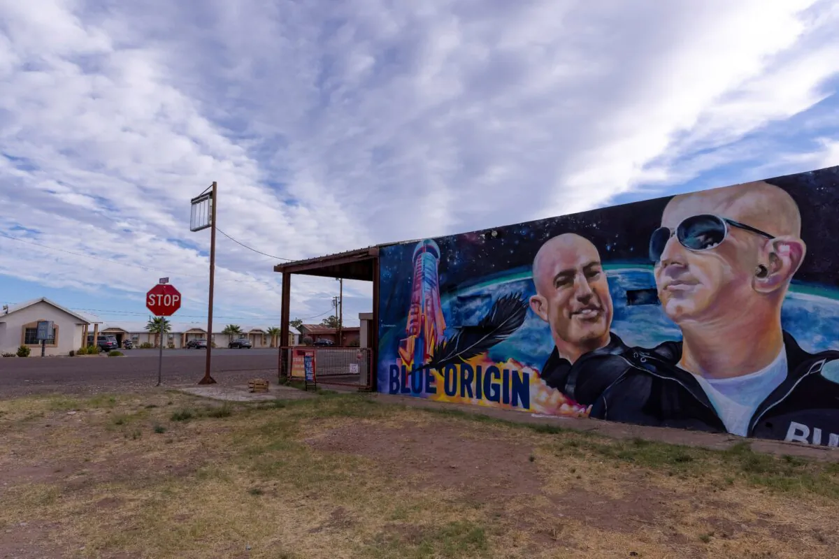 A mural of billionaire Jeff Bezos and his space company Blue Origin a day before his company will send "Star Trek" actor William Shatner into space from the company's facilities in Van Horn, Texas, on Oct. 12, 2021. (Mike Blake/Reuters)