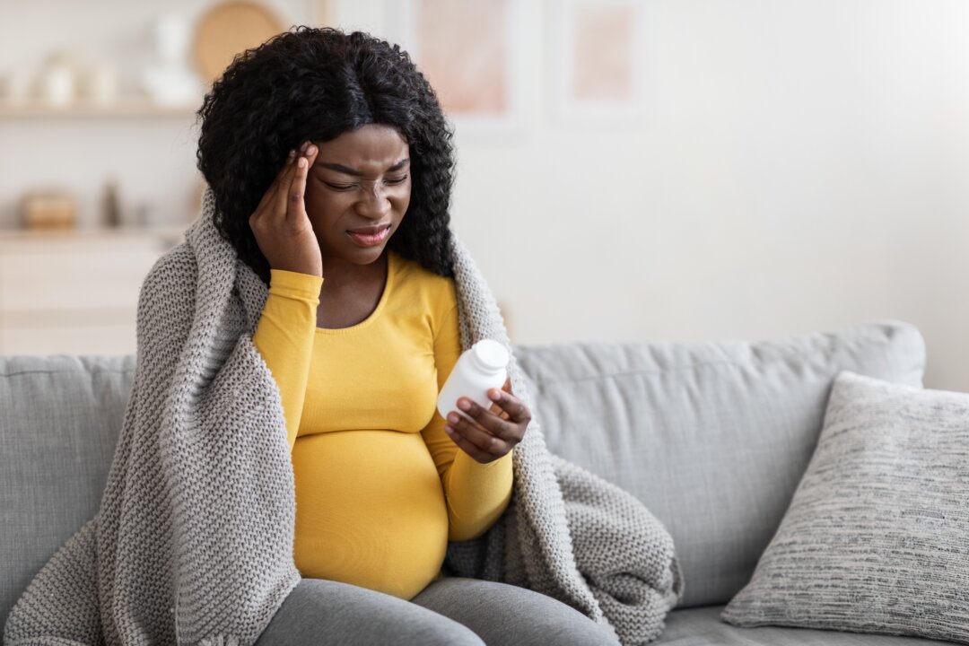 Mounting evidence shows that taking acetaminophen—known by its brand name Tylenol—during pregnancy may pose risks to the fetus and to early childhood development. (Prostock-studio/Shutterstock)